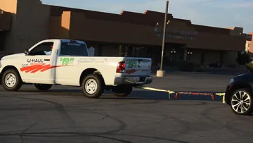 Side view of the pickup and SUV in the original BLINCOO rope demonstration