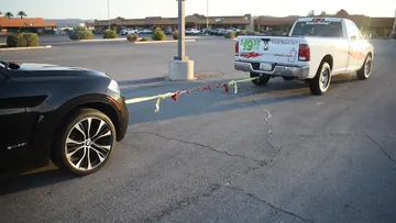 Three-quarter view of the SUV and BLINCOO rope demonstration setup