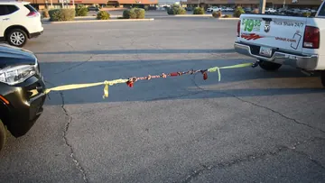 Wide parking-lot view of the original BLINCOO rope demonstration